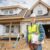 Realtor and builder David Olson in a hard hat at a new home under construction